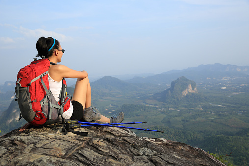 hiking woman enjoy the view on mountain peak