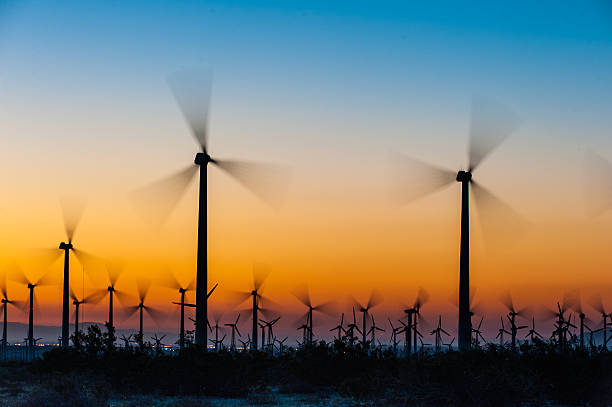istock Wind Turbines in desert during sunrise time 464498358