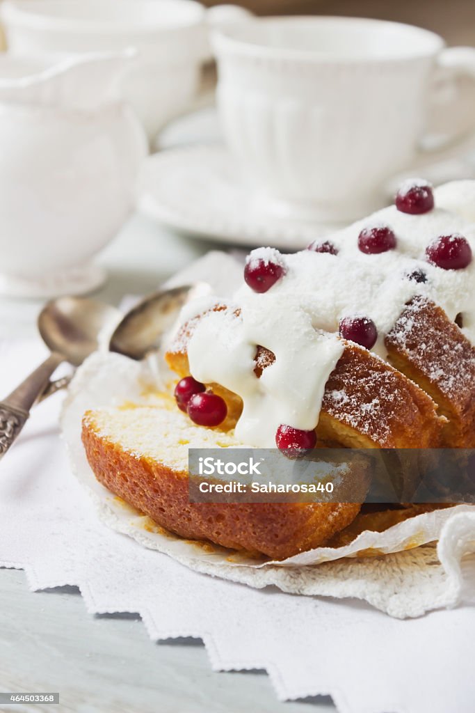 cupcake with white frosting arge sliced cupcake with white frosting and fresh cranberries on the holiday table. holiday meal. selective focus 2015 Stock Photo