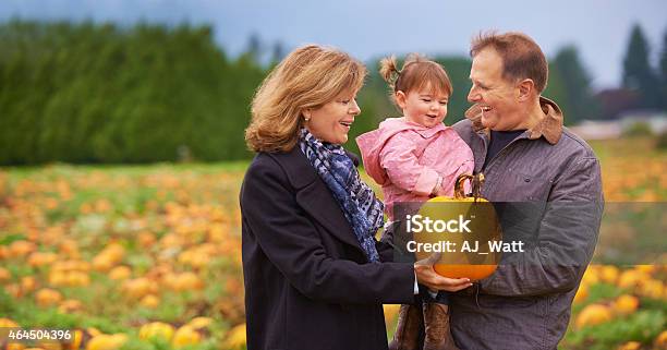 Shes Our Little Pumkin Stock Photo - Download Image Now - Mature Couple, Child, 18-23 Months