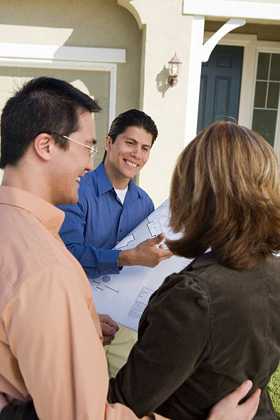 istock Architect showing plans to couple 464504638
