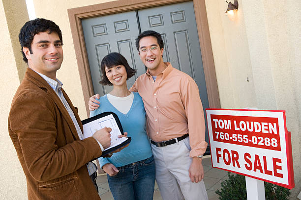 istock Couple with new home 464509290