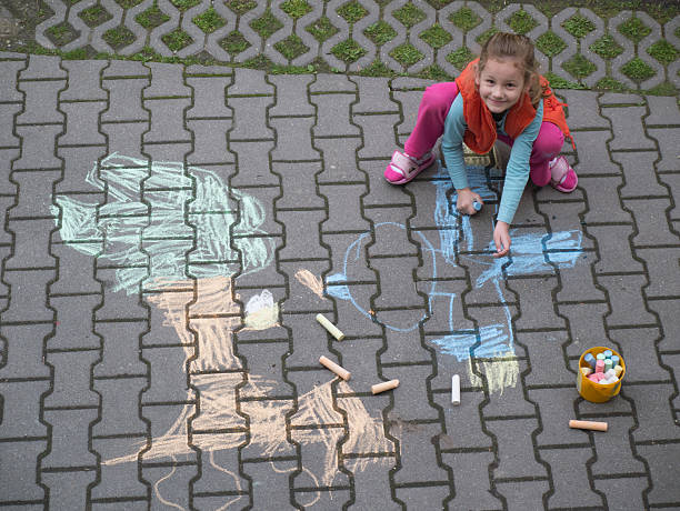 istock young girl drawing 464509878