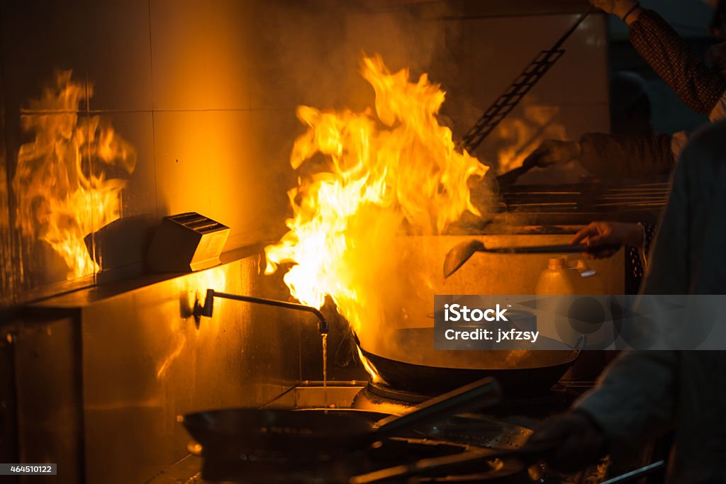fire in the kitchen cooking in the kitchen Commercial Kitchen Stock Photo