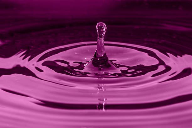 istock Water splash in radiant orchid 464514499