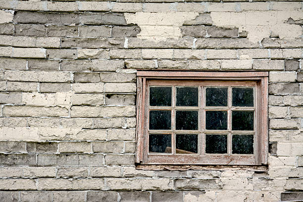 Very old window in the side of a farm house Mud brick building and glass window kearney county stock pictures, royalty-free photos & images
