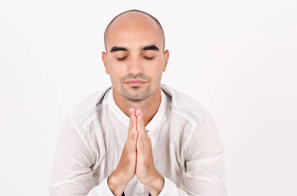 istock Spiritual man praying and meditating. 464518301