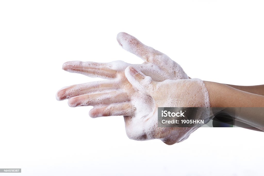 Washing Hands A woman washing her hands with a soap suds One Woman Only Stock Photo