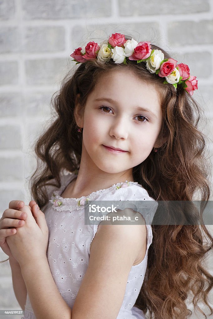 Portrait of a beautiful little girl Beautiful little girl in a wreath Beautiful People Stock Photo