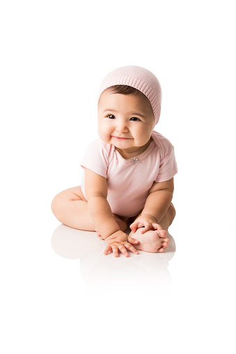 Cute baby girl smiling isolated over white background