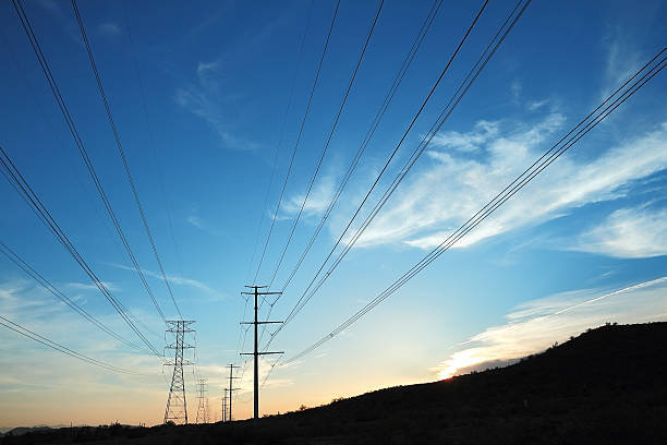 istock Power transmission towers at sunset 464520920