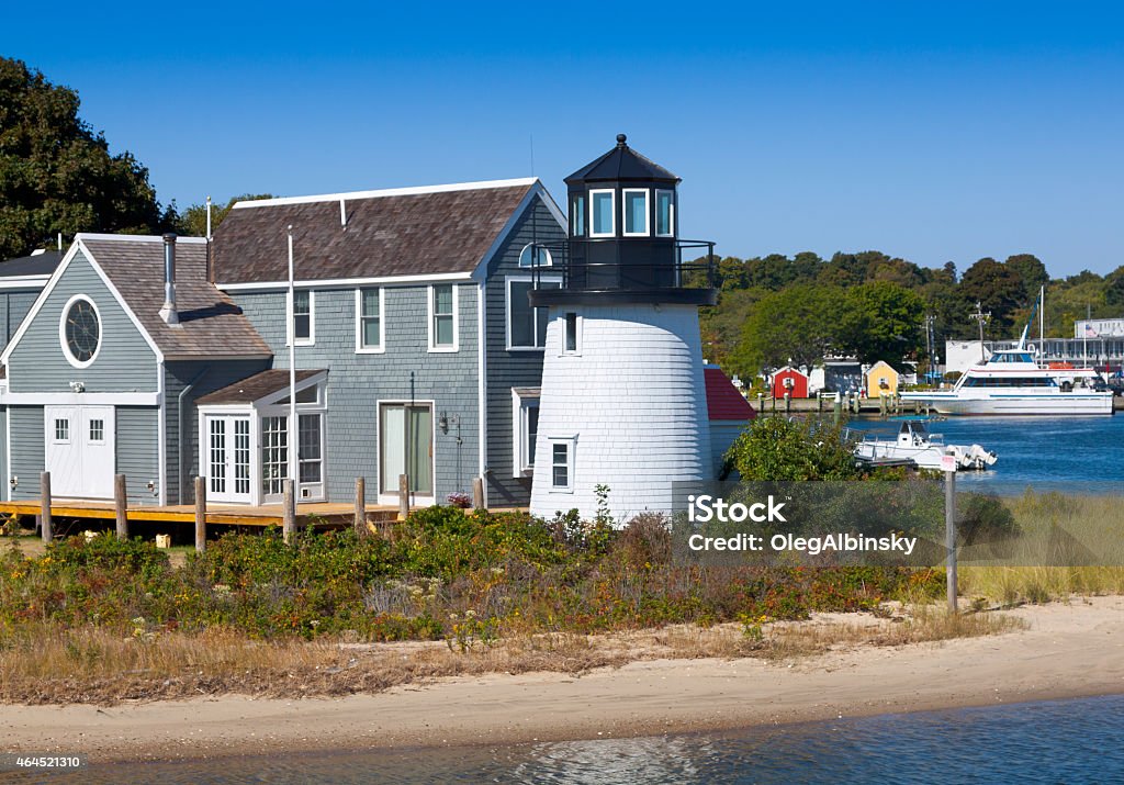 Lewis Bay Lighthouse in the morning, Hyannis, Cape Cod, Massachusetts. Lewis Bay Lighthouse, Hyannis, Cape Cod, Massachusetts, USA. Hyannis Marina is in background. This HDR photorealistic image is lit by the morning sun. Canon EF 24-105mm f4L IS USM Lens. 2015 Stock Photo