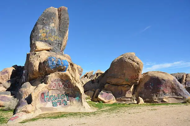 Photo of Graffiti Covered Boulders in California Desert
