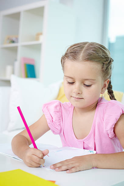 istock Little girl drawing 464524529