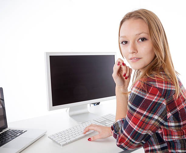 istock girl sitting with laptop computer 464524888