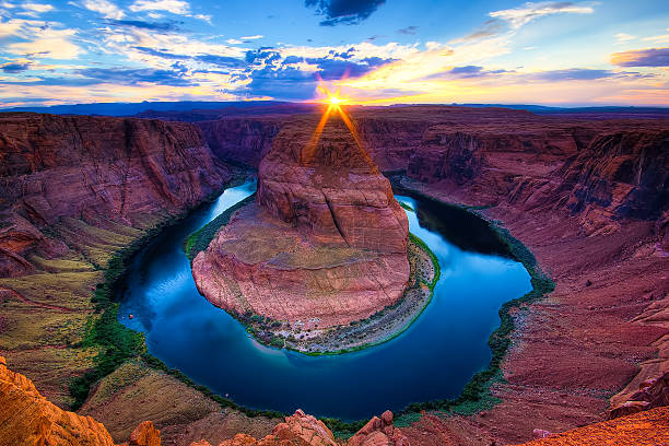 The Horseshoe Bend Canyon, Arizona scenics Sunset at The Horseshoe Bend, Page - Arizona. Amazing Grand Canyon of the Colorado River. Sunburst. horseshoe bend river stock pictures, royalty-free photos & images
