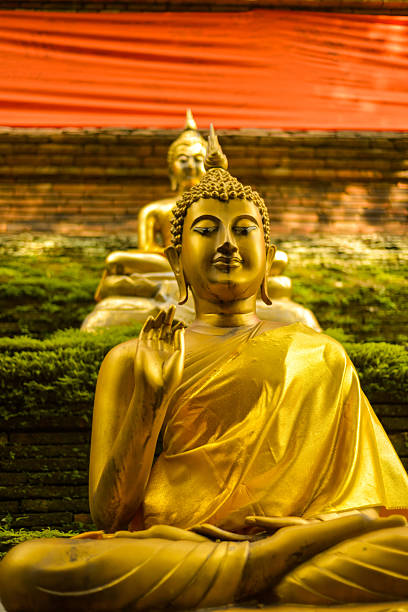 istock Gold Buddha Statues and Cloth Wrapped Chedi, Thailand 464528170