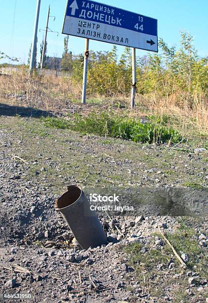 Shell Stuck In The Road Stock Photo - Download Image Now - Civilian, Ukraine, War