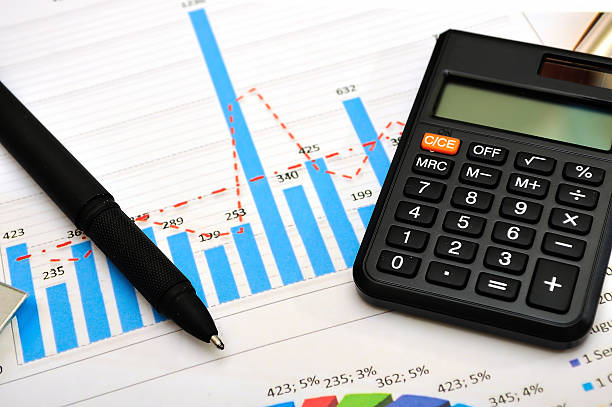istock Financial paper charts and graphs 464533394
