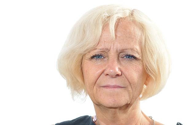 istock Mature blonde woman on white background. 464533844