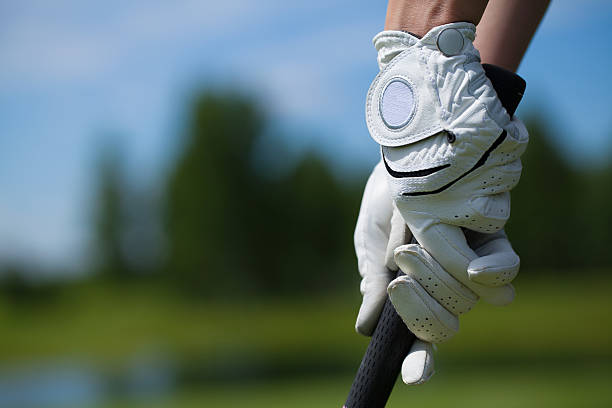 Golf player gloves hold the iron or putter Golf player white gloves hold the iron or putter in right pose golf glove stock pictures, royalty-free photos & images