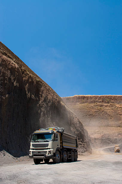 istock Truck and bulldozer work in the quarry 464536920