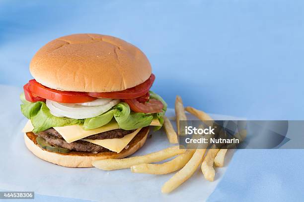 Delicious Cheese Burger With Milk And Tomato Sauce Stock Photo - Download Image Now - Bun - Bread, French Fries, Hamburger