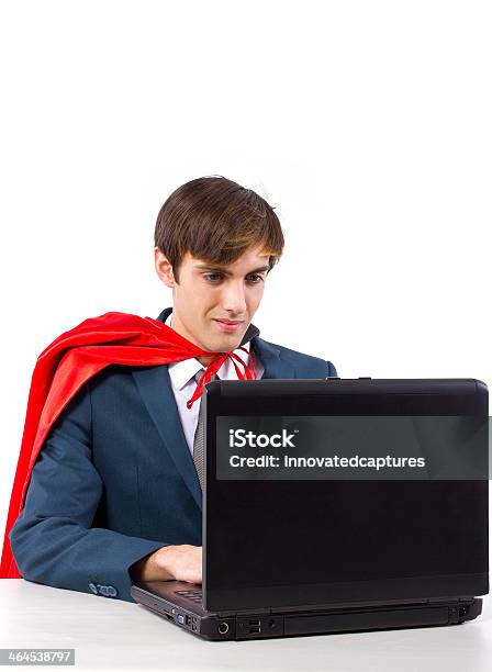 Super Businessman With A Red Cape Working On A Laptop Stock Photo - Download Image Now