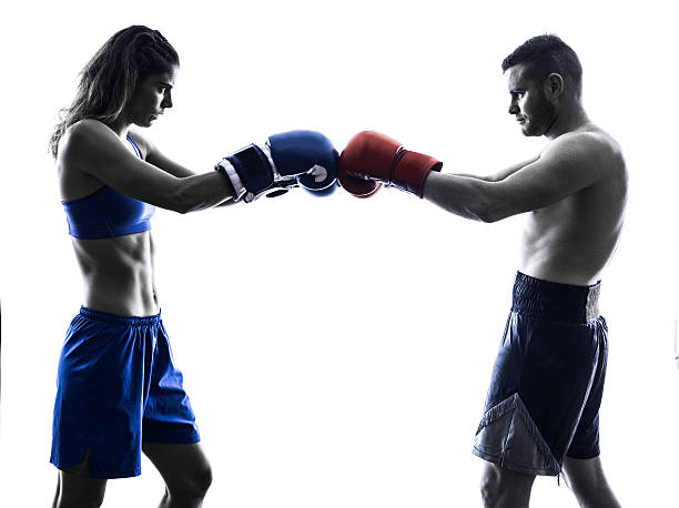 istock woman boxer boxing man kickboxing silhouette isolated 464541778