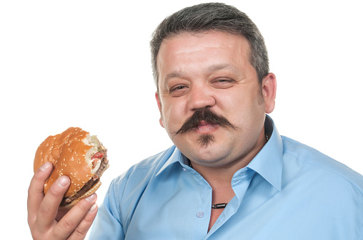 Plus size man in studio photos with white background.