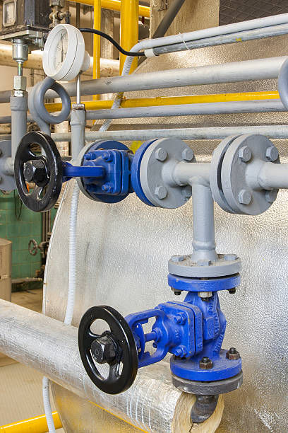 istock Pipes and faucet valves of heating system 464546274