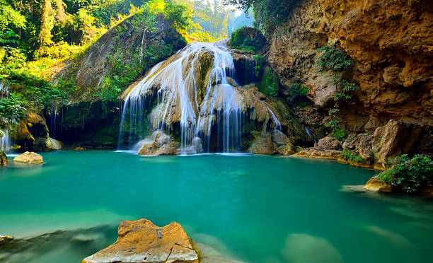istock Waterfall spring season located in deep rain forest jungle. 464550135