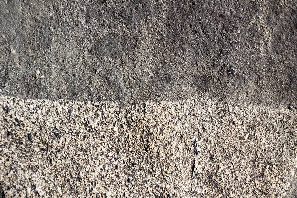 istock Boundary of two surfaces of natural  stone as background 464551097