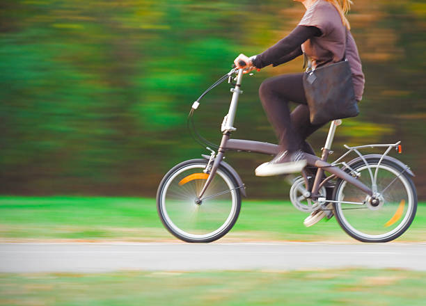 istock Lady Cycling in the Park 464551487