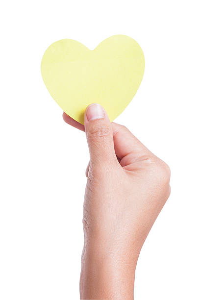 istock hand holding paper heart, 464551509