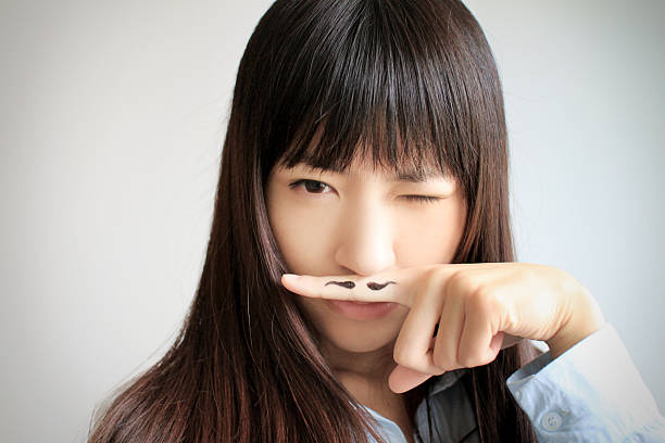 istock girl with mustache 464551517