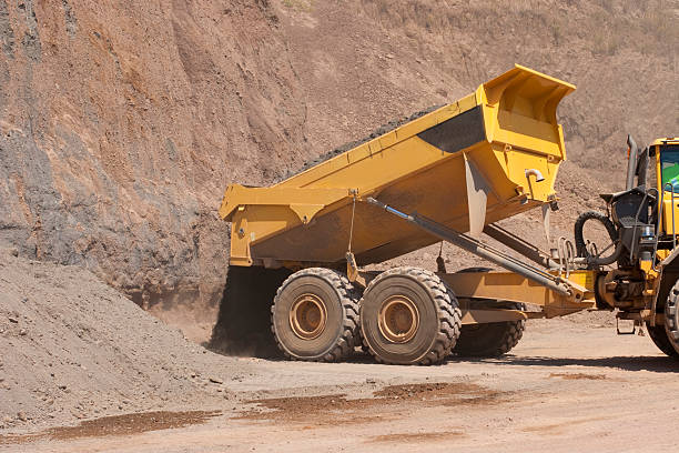 istock Truck and bulldozer work in the quarry 464553724