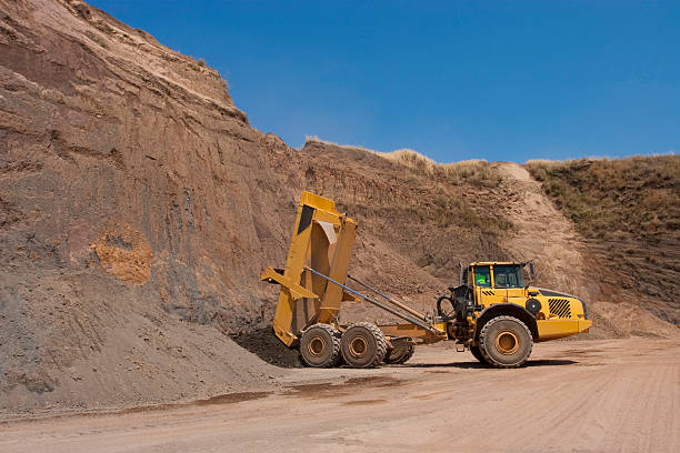 istock Truck and bulldozer work in the quarry 464553728