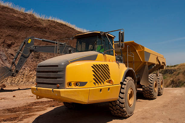 istock Truck and bulldozer work in the quarry 464553732
