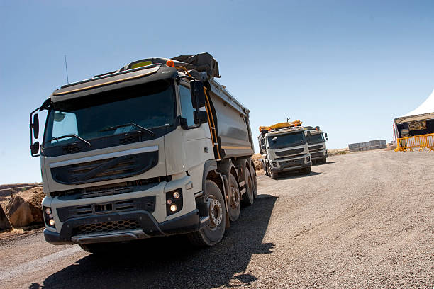 istock Truck and bulldozer work in the quarry 464553742