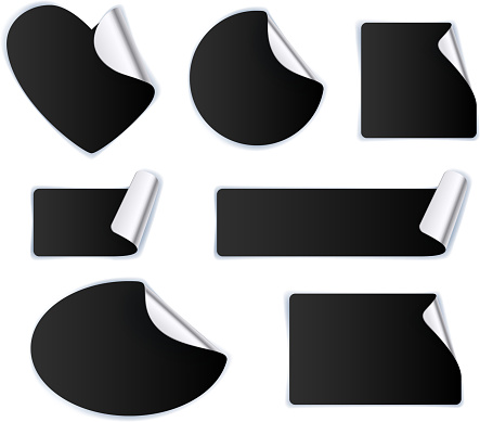 Set of black stickers - silver foil reverse side. Peeled off paper labels. Heart, circle, square, oval.