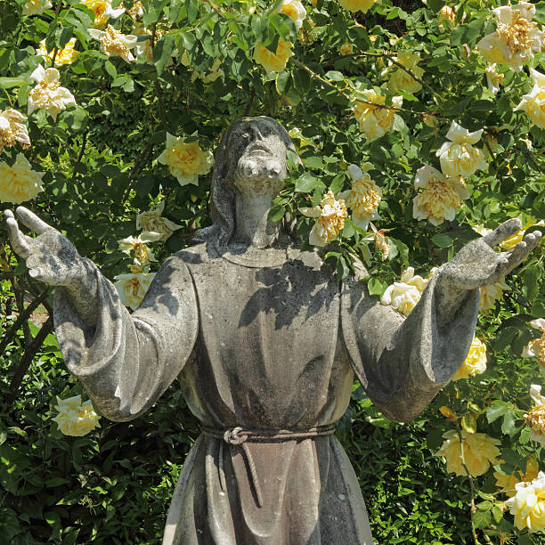 istock Jesus statue and roses 464556223
