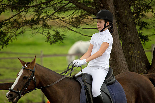 istock girl warming up for horse competition 464559779