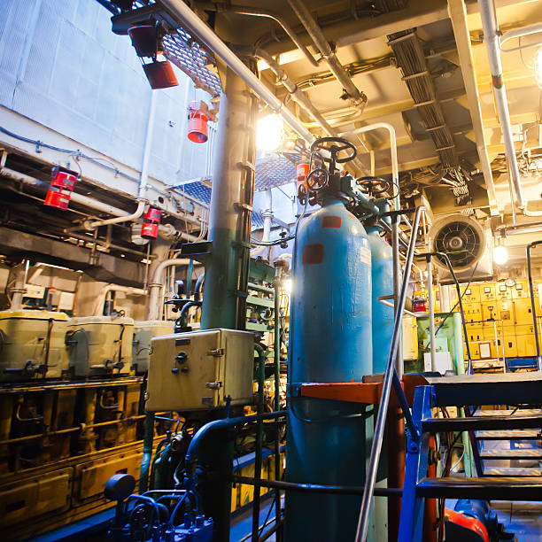 istock Engine room on a cargo boat ship with gears 464560056
