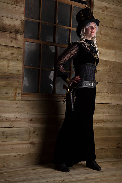 istock Steampunk Gunfighter Outside An Old Cabin 464560393