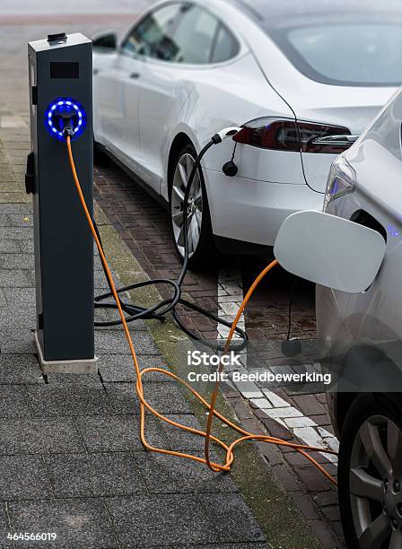 Recharging In The Street Stock Photo - Download Image Now - Electric Car, Car, Gas Station