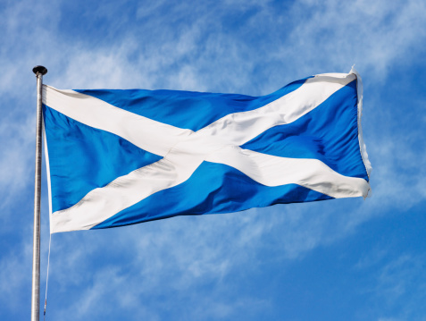 A Scottish flag in strong wind.