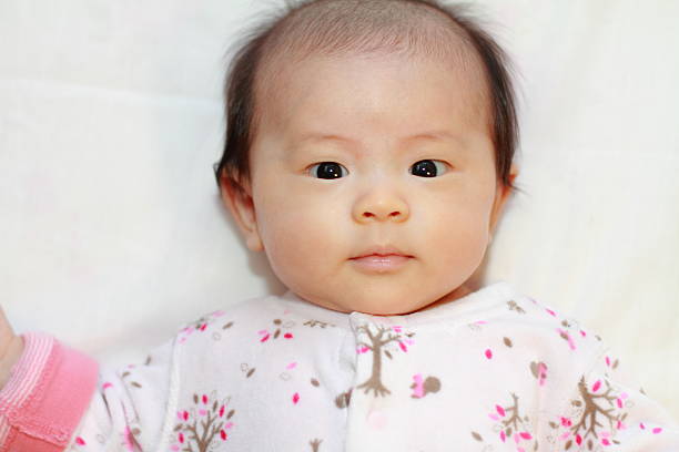 istock Smiling Japanese baby girl (0 year old) 464569810