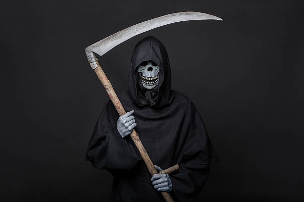 istock Death with scythe standing in the dark. Halloween 464570268