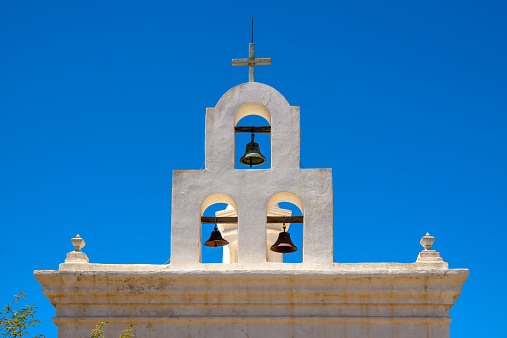 San Xavier del Bac Mission, White Mission Church Building bell tower, Tucson, Arizona, Clear blue sky